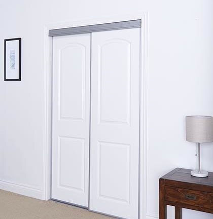 Sliding Bypass Door With Primed 2 Panel Arched Top Design Insert