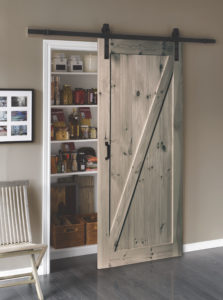 A picture of a L057 sliding barn door in a kitchen.